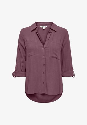 Naiste mauve-nuppudega särk kraega, pika varrukaga, mis on üles keeratud, kahe rinnataskuga ja kaardus äärega.