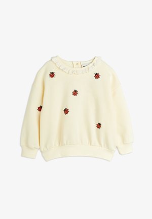 Felpa crema con un colletto testurizzato, featuring delle coccinelle rosse ricamate e accenti neri sparsi su tutta la superficie.