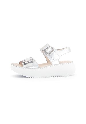 Silver metallic sandals with two adjustable straps, a wide white platform sole, and stitched detailing along the edge.