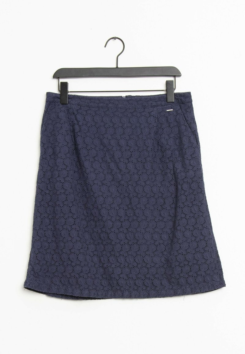 Navy blue A-line skirt made of textured fabric with a pattern of cutouts, featuring a zip closure and a small brand tag near the waistband.