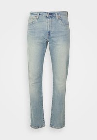 Ljus tvättad denimjeans med rak ben-design. Har fem fickor, sömnadsdetaljer och knappgylf. Mjuk, urtvättad textur.