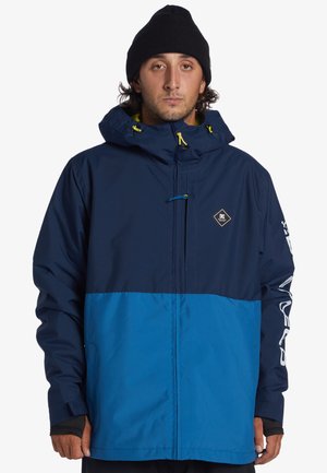 Námořnická a modrá dvoubarevná snowboardová bunda s kapucí, žlutými šňůrkami a logem. Texturovaná tkanina s elastickými manžetami a kapsami.
