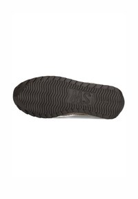 Black rubber shoe sole with textured grooves and ridges; features the letters "MS" embossed on the surface.