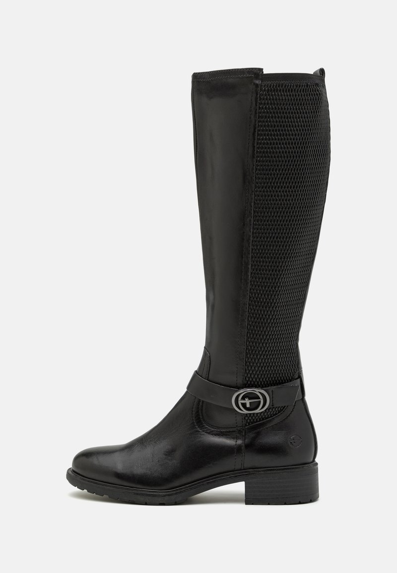 Black knee-high boot with glossy leather and mesh panel, featuring a buckle strap, round toe, and a low stacked heel for stability.