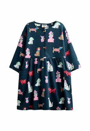 Langärmliges Kinderkleid in Marineblau mit bunten Cartoon-Hundemustern und Holzknöpfen auf der oberen Vorderseite.