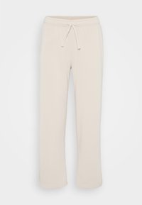 Pantalone od krem boje ravnog kroja s elastičnim pojasom i vezicom na jednobojnoj bijeloj pozadini.