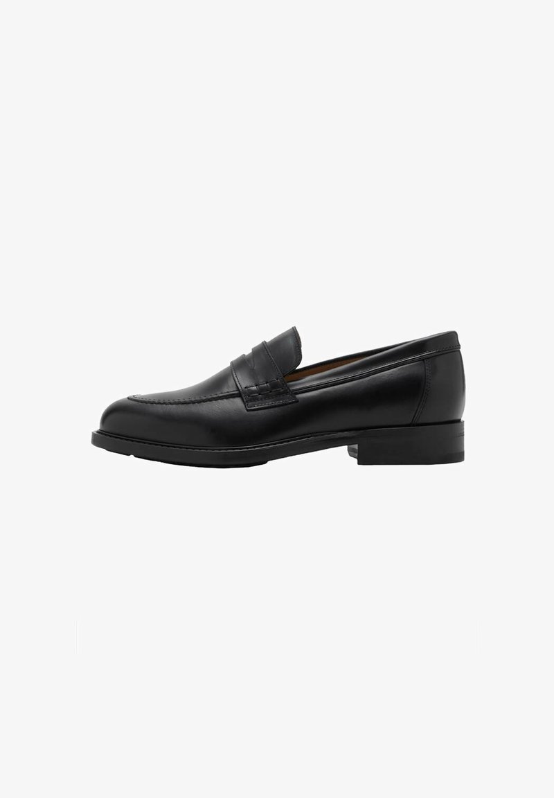 Crne kožne loafers c revama sprijeda i ravnim potplatom. Glatka tekstura s okruglim vrhom i ukrasnom trakom preko instep-a.