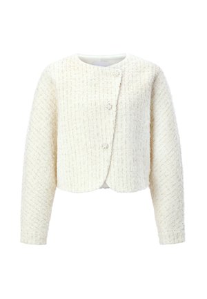 Chaqueta blanca texturizada con diseño crop, escote redondo y dos botones decorativos. Presenta un tejido entrelazado con un patrón sutil.