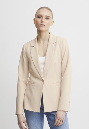 Beige střihový sako vyrobené z hladkého materiálu, s klopovými límci, dvěma předními kapsami a zapínáním na jeden knoflík.