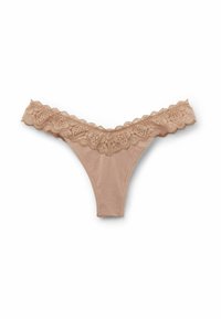 String nu avec une taille en dentelle florale ; tissu doux, design en V, bords festonnés et motif brodé complexe.