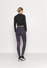 Nike Performance FAST - Leggings de corrida - dark raisin/silver