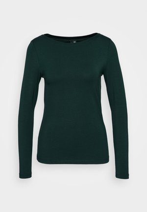 Tumesiniste varrukatega topp, valmistatud pehmest kangast. Omab ümmargust kaelust ja sobivat disaini ilma õmblusteta servadega. Minimalistlik stiil.