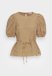 Blusa peplum a quadri gialla e marrone, con maniche a sbuffo, un nastro in vita e una chiusura sul retro. Tessuto leggero.