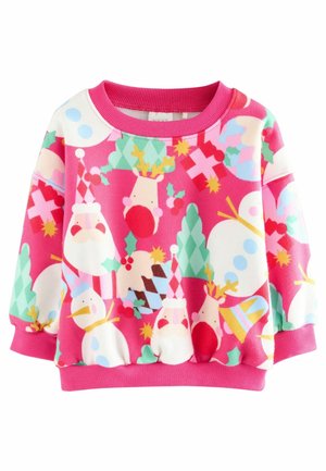 Pull pour enfants rose avec des motifs de Noël colorés comprenant des visages du Père Noël, des bonhommes de neige, des rennes, des cadeaux et des arbres.
