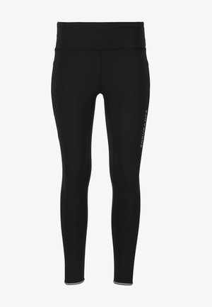 Leggings de sport noirs en tissu lisse et extensible. Ils disposent d'une taille haute et d'une marque minimale sur la jambe gauche.