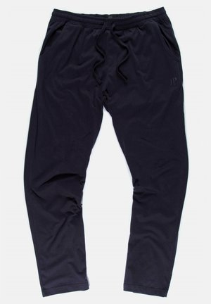Černé joggingové kalhoty vyrobené z měkké tkaniny, s elastickým pasem, stahovací šňůrkou a dvěma bočními kapsami.