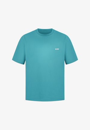 Turquoise cotton t-shirt with short sleeves, crew neck, and a small white logo patch on the left chest. Smooth texture, straight cut.