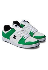 White and green sneakers with a leather upper, round toe, and lace closure. Features a padded tongue and collar with black accents.