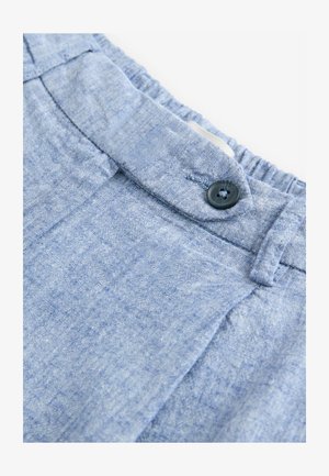 Hele sinine kangas pehme ja tekstureeritud viimistlusega, millel on elastne vöökoht ja üks must nupudetail.