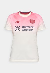 White and pink short-sleeve soccer jersey with textured fabric, crew neck, team logo on the chest, and sponsor branding in blue.