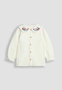 Blusa larga blanca para bebé de manga larga con botones de madera y cuello tipo Peter Pan bordado con flores de colores.