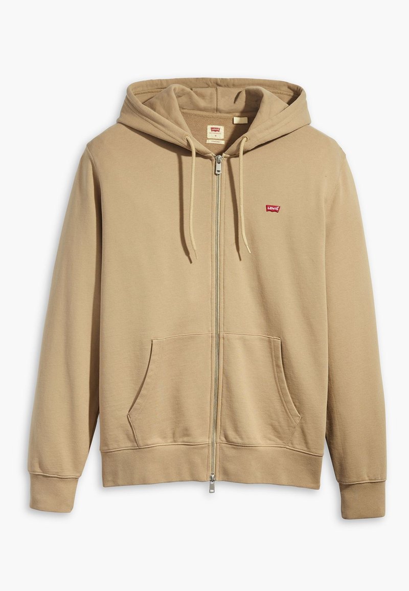 Bežs kapucis ar rāvējslēdzēju, izgatavots no mīkstas auduma. Iespējo liela kapuce, priekšējās kabatas un sarkanais Levi's logo uz krūtīm.