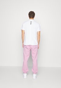 Lacoste CLASSIC - Calças de fato de treino - rose