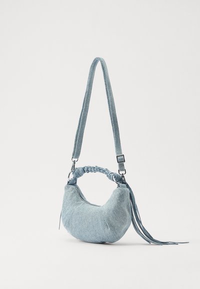 Holzweiler COCOON MICRO BAG UNISEX - Mala de mão - blue