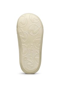 Krémová podrážka obuvi s texturovaným povrchem, vyznačující se embosovaným vzorem loga a kruhovými designovými prvky. Světlá a pružná.
