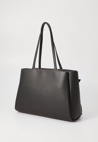 Black leather tote bag with a structured shape, smooth texture, and elongated handles. Features subtle gold accents at attachment points.