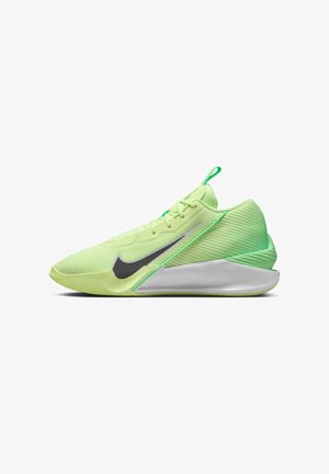 Jasnozielony but do biegania Nike z czarnym logo, teksturowanym piętą i grubą białą podeszwą pokazany w lewym profilu.