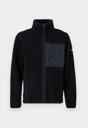 Zwarte fleecejas met een opstaande kraag, ritssluiting aan de voorkant en een borstzak aan de linkerkant in glad materiaal. Geweven stof met een zachte oppervlakte.