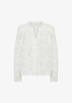 Bluza albă cu mâneci lungi, cu model de dantelă florală, guler mic cu volane, închidere cu nasturi în față și manșete adunate.