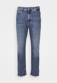 Ljusblå jeans i denim med rak skärning, fem fickor, knappstängning och minimal blekning. Ankelkorta fållar, inga mönster eller utsmyckningar.