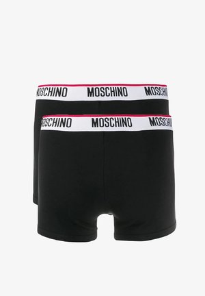 Boxers en coton noirs avec une large ceinture blanche sur laquelle est inscrit "MOSCHINO" en noir. La ceinture a une subtile accent rose.