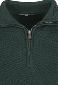 Donkergroene zip-up trui van een textiel met een structuur, geribbeld kraag en metalen ritssluiting. Heeft een opstaande kraag.