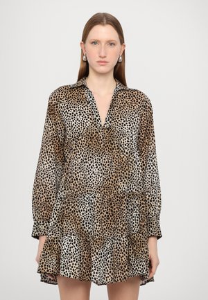 Leopard-print dress with a collar, long sleeves, tiered ruffle hem, in shades of brown, black, and white, made from a smooth fabric.