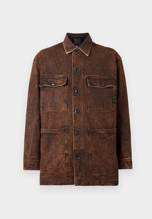 Brown denim jacket with four front pockets, button closure, and a subtle distressed texture. Features contrast stitching and a classic collar.