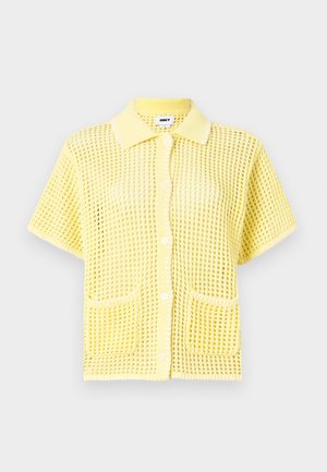 Short-sleeve, yellow mesh button-up shirt with a collar, featuring two front pockets and a loose fit. Textured pattern throughout.