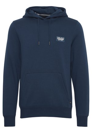 Tummansininen huppari, joka on valmistettu pehmeästä kankaasta. Siinä on etupuolella kengurupussi, ribbaatut hihansuukkeet ja pieni brändilogo rintaan ommeltuna.