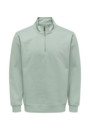 Lysegrønn genser med lange ermer og kvartglidelås, ribbestrikkede mansjetter og midjebånd, laget av mykt, glatt stoff.