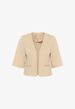 Beige lyhythihainen blazeri, jossa on V-pääntie, kaksi etutaskua ja sileä pintakuvio. Mukana vetoketjusulku ja hienovaraiset ompelutyylit.