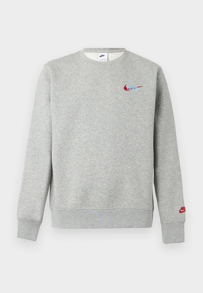 Light grey crewneck sweatshirt with small red and blue Nike logos on chest and left sleeve, ribbed cuffs and hem.