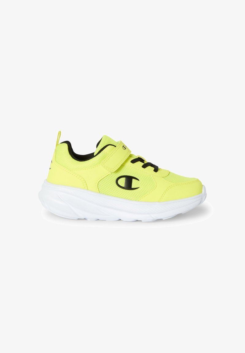 Neon żółte buty sportowe z siateczkową cholewką, czarnymi akcentami, rzepem i sznurówkami, połączone z białą, amortyzującą podeszwą.