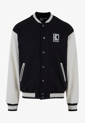 Sort og creme varsityjakke i uldblanding, med ribbede manchetter, trykknapper, sidelommer og broderet logo.