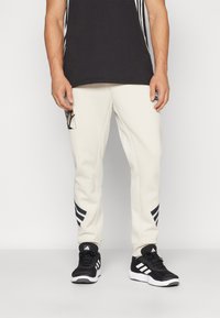 adidas Sportswear - STAR WARS THE MANDALORIAN™ - Treniņtērpa apakšdaļas - clear brown Miniatūras attēls 1