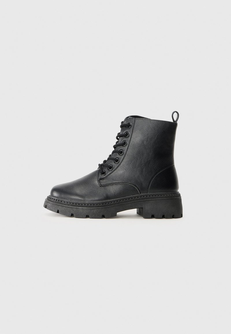 Black leather ankle boots with a textured finish, round toe, lace-up front, and chunky rubber sole featuring a pull tab at the back.