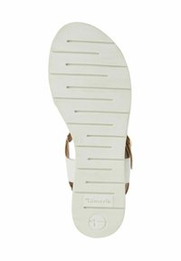 Semelle de sandale blanche avec texture striée, présentant une surface lisse et un accent circulaire marqué. Comprend une indication de taille.