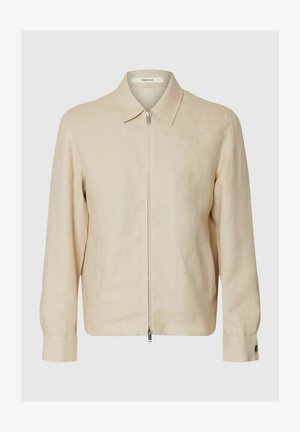 Beige langermet jakke med glidelås, krage, to sidelommer og knappede mansjetter.