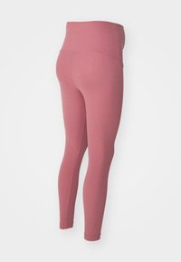 Rosa leggings med hög midja, tillverkade av texturerad tyg, med en kroppsnära design och sömlös konstruktion.